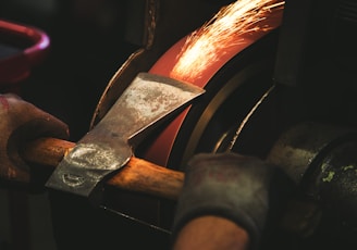 person holding brown handheld tool