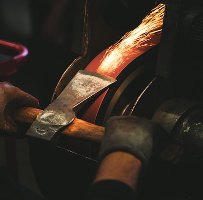 person holding brown handheld tool