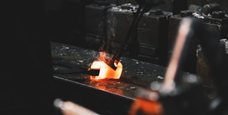 person holding forging tong