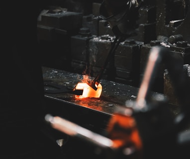 person holding forging tong