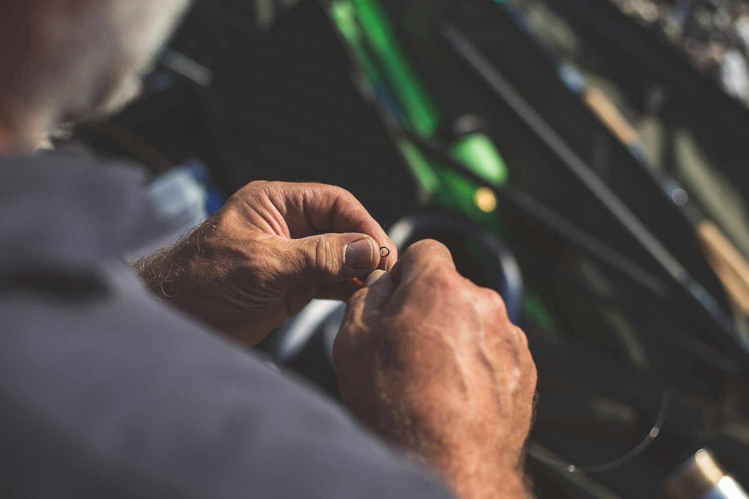 man holding fish hook