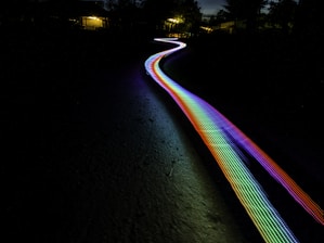 multicolored light passage in dark area