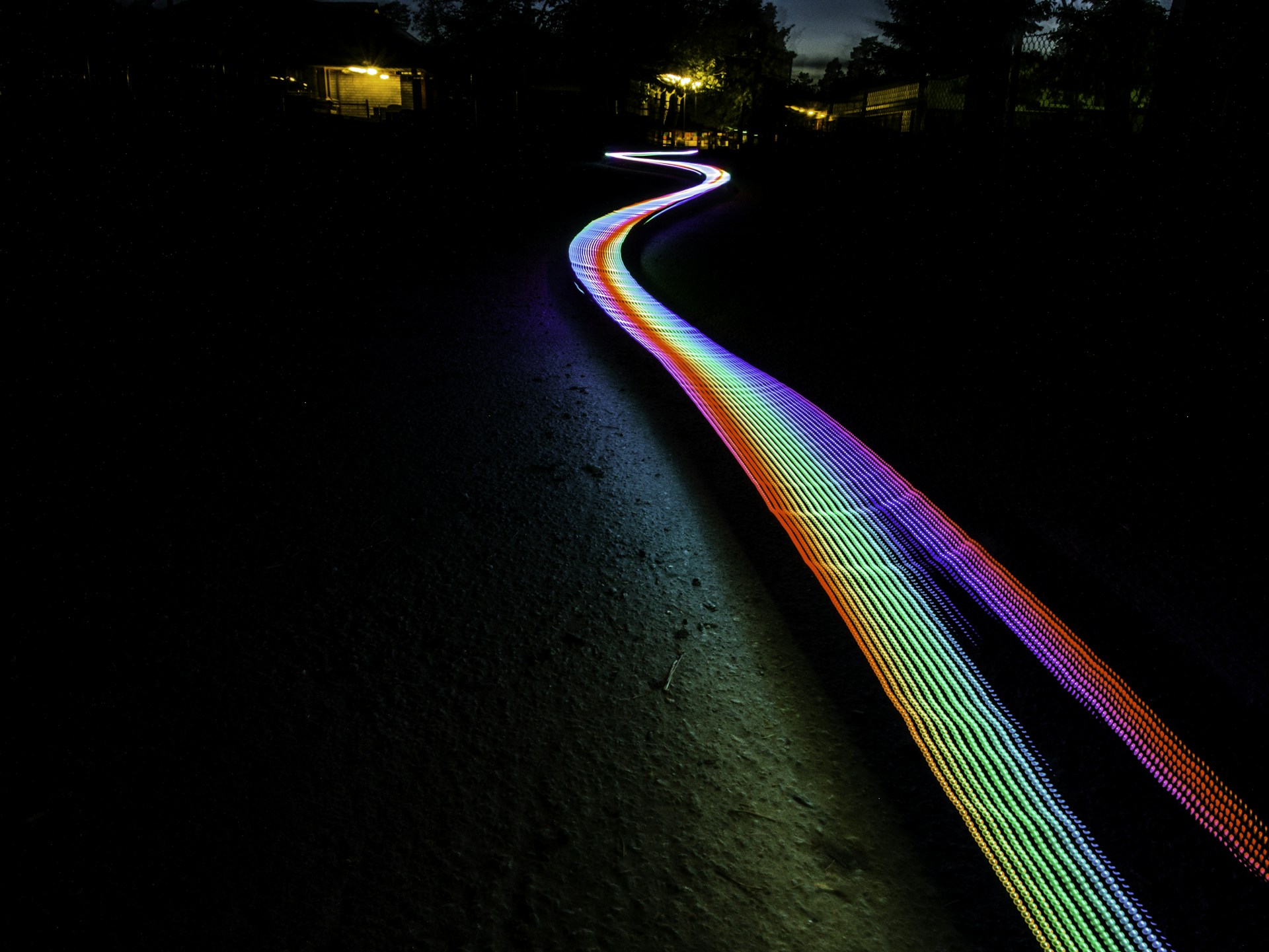 multicolored light passage in dark area