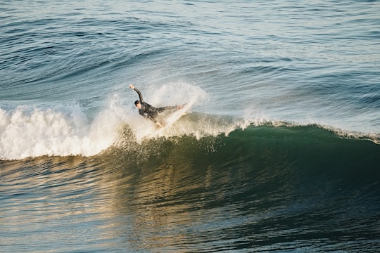 man surfing on waves during daytime in Malibu United States