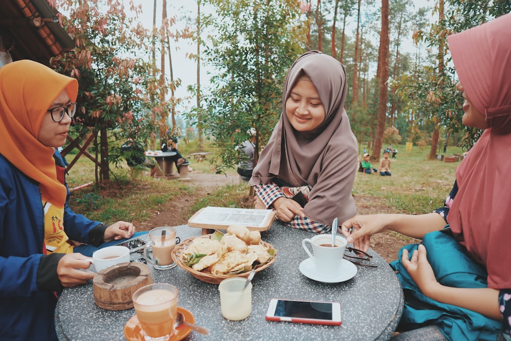 woman sitting in front of table