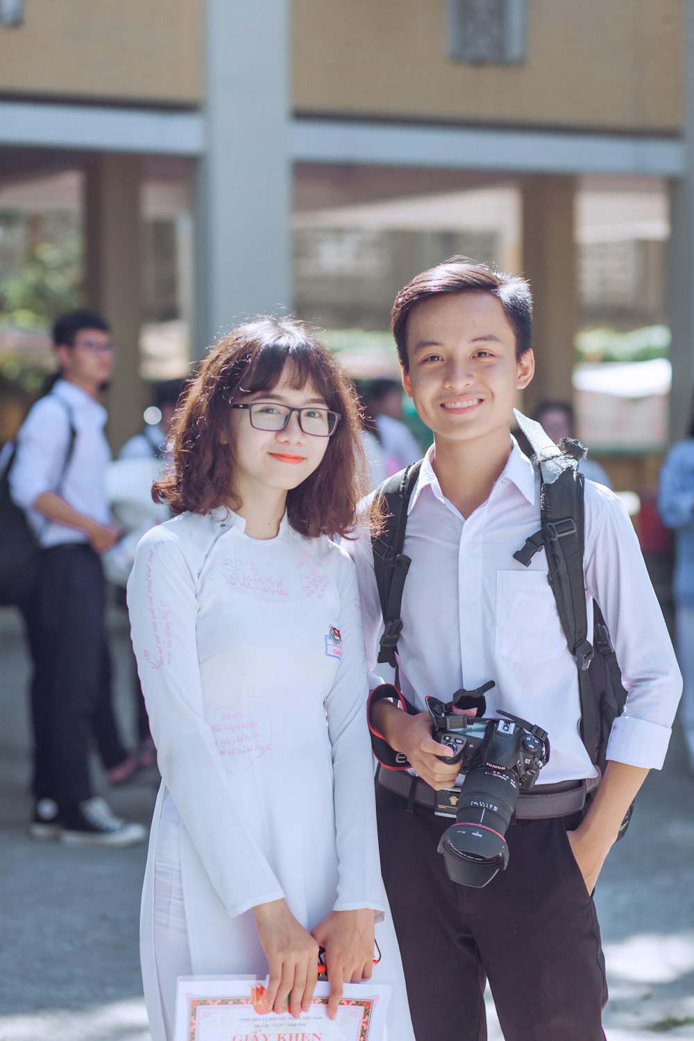 person holding black Canon EOS DSLR camera