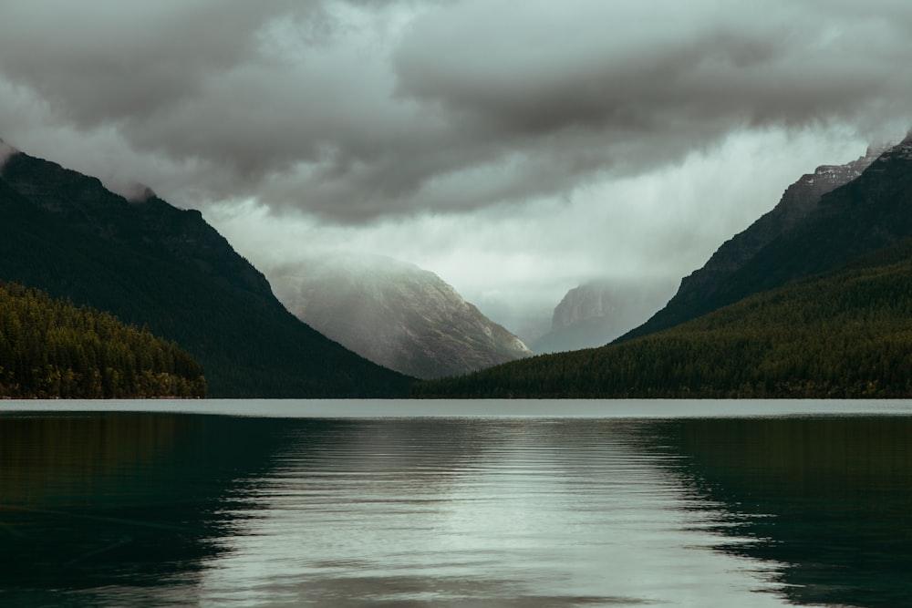 body of water surrounded with mountains