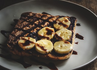 toasted bread with sauce on gray plate