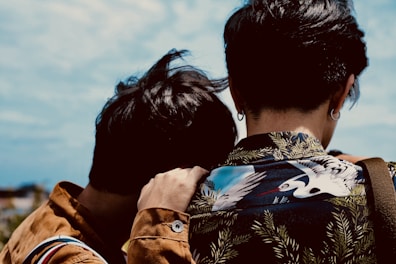two people comforting each other