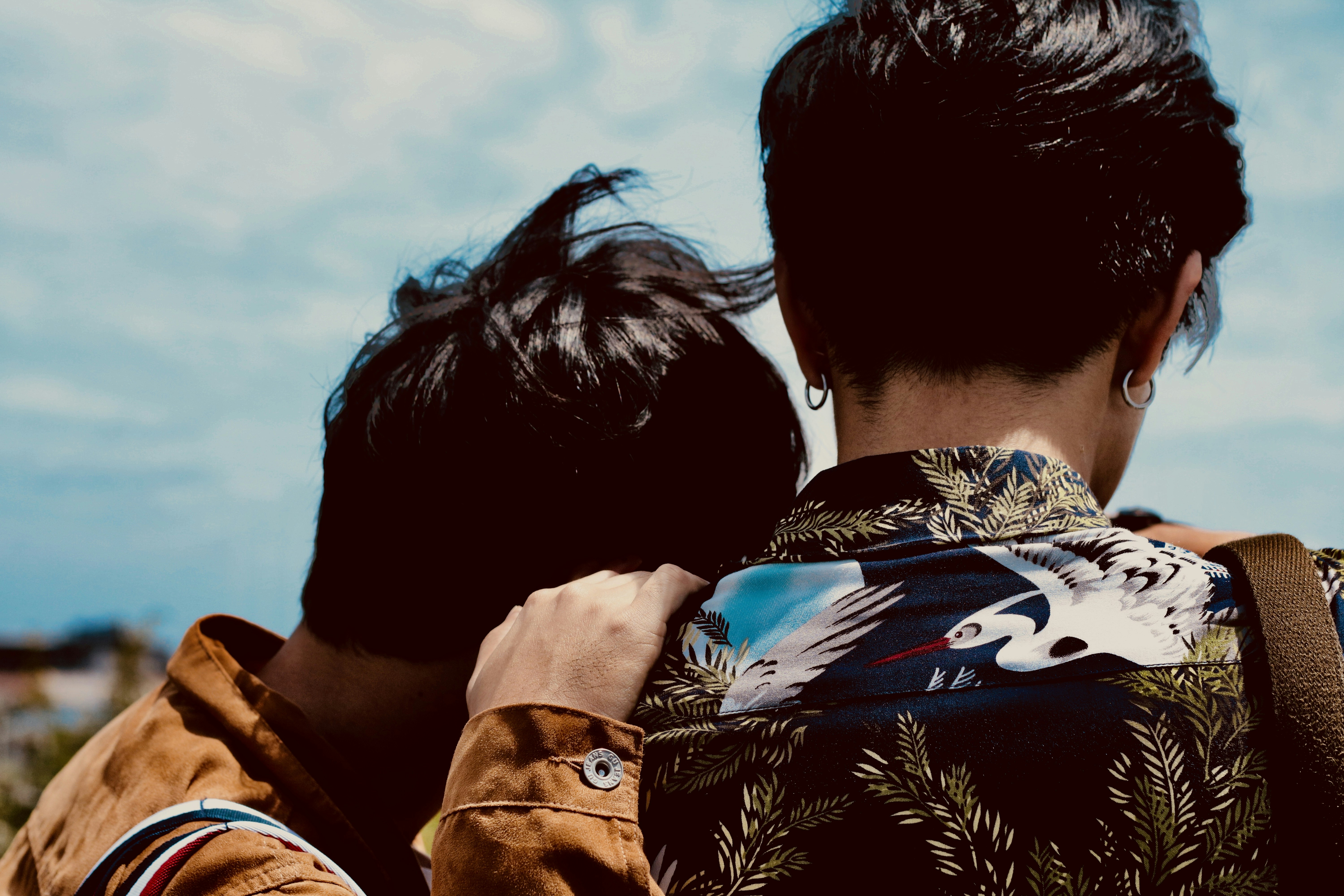 two boy's looking at sky