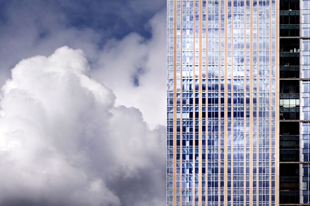 curtain wall building near clouds