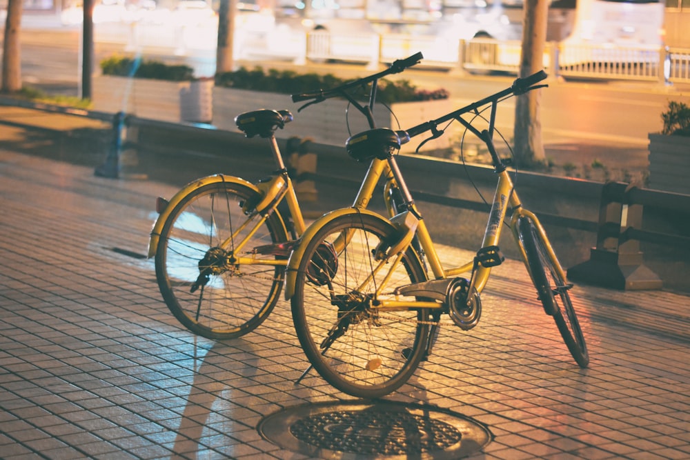 two yellow dutch bicycles parking on street