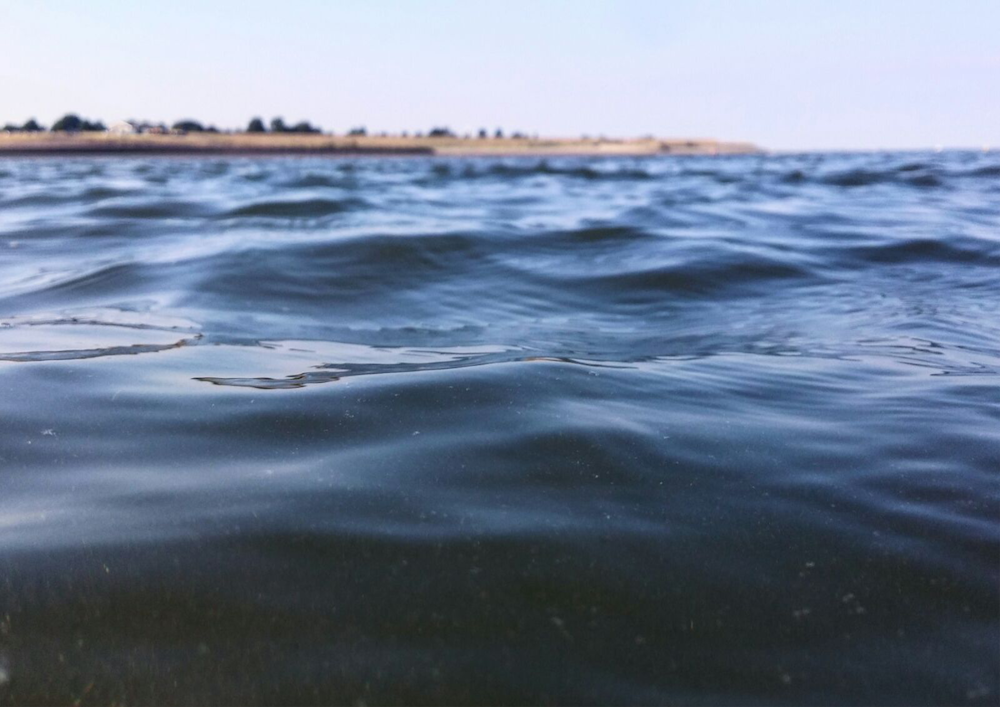 calm sea water near at daytime