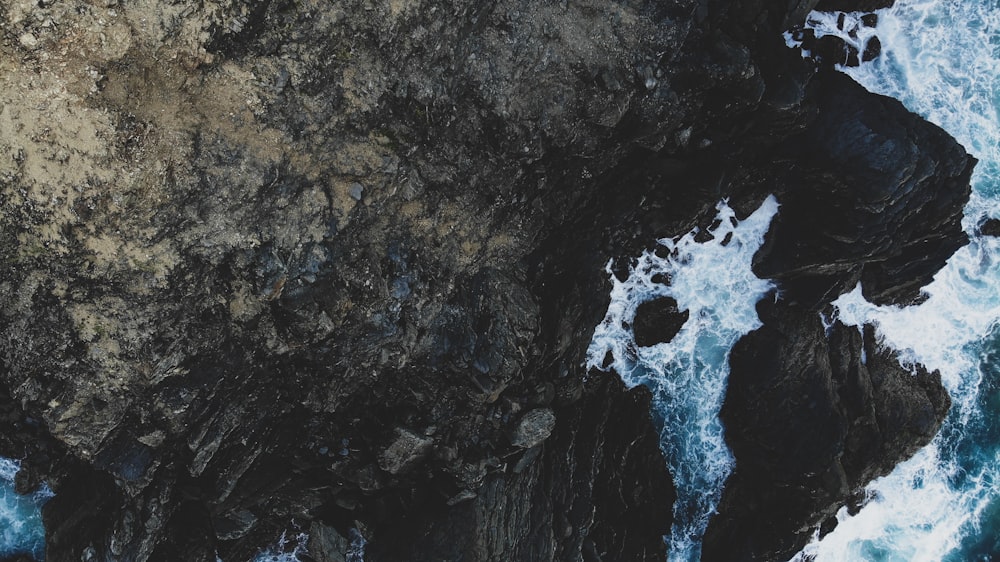 top view photo of mountain cliff near sea