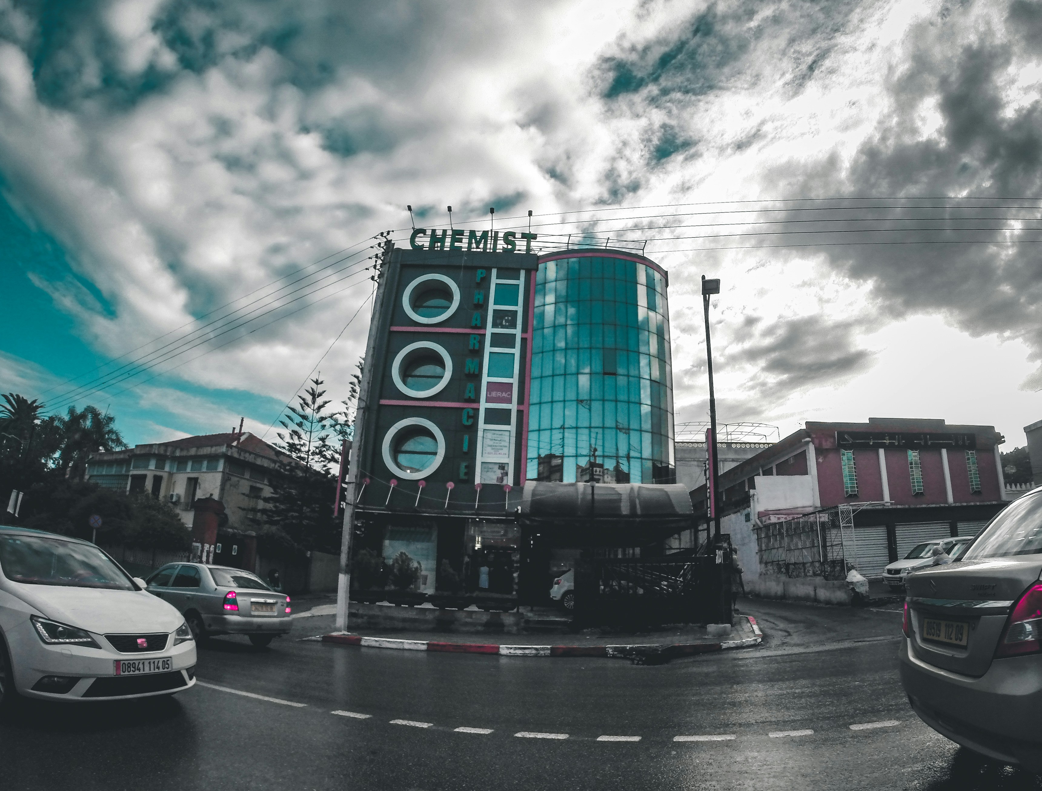 vehicles on road beside building