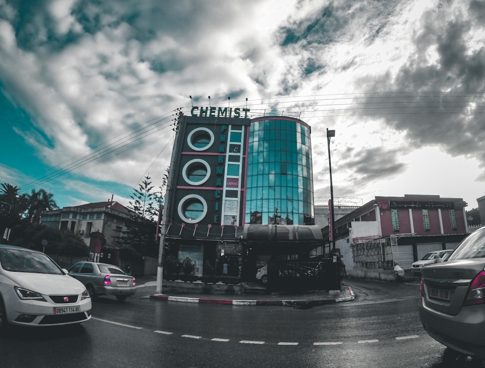 vehicles on road beside building