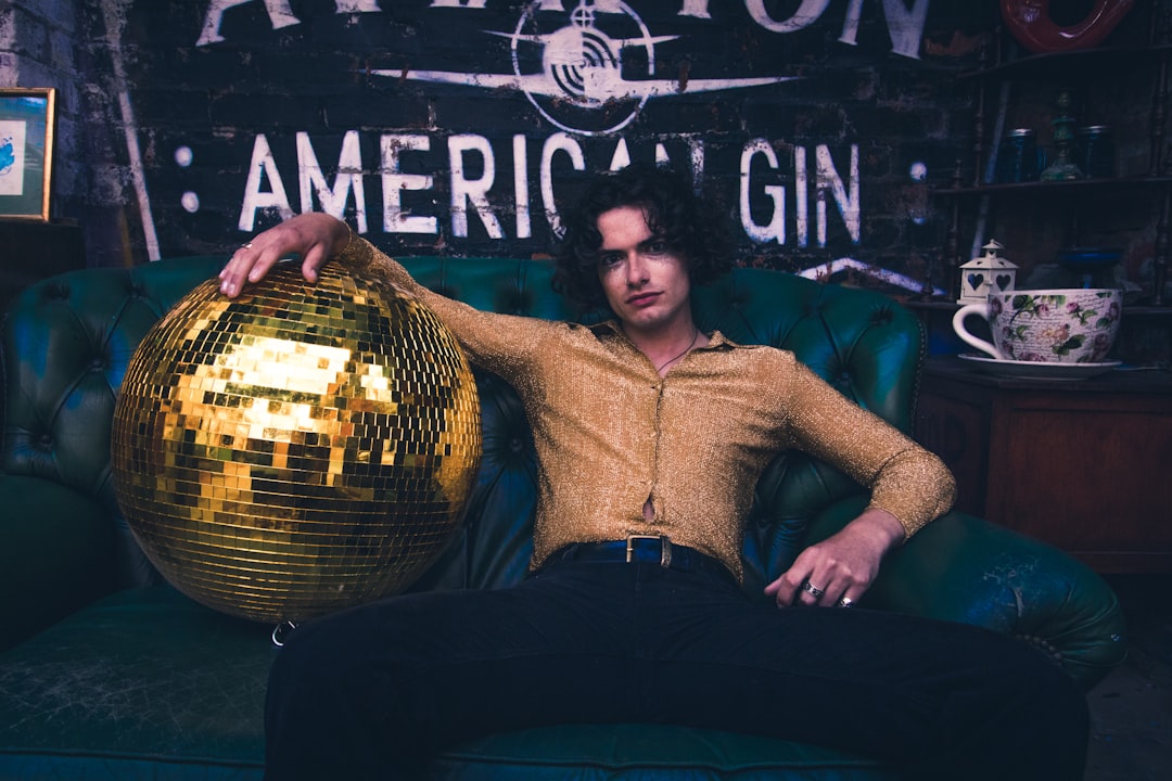 man holding disco ball