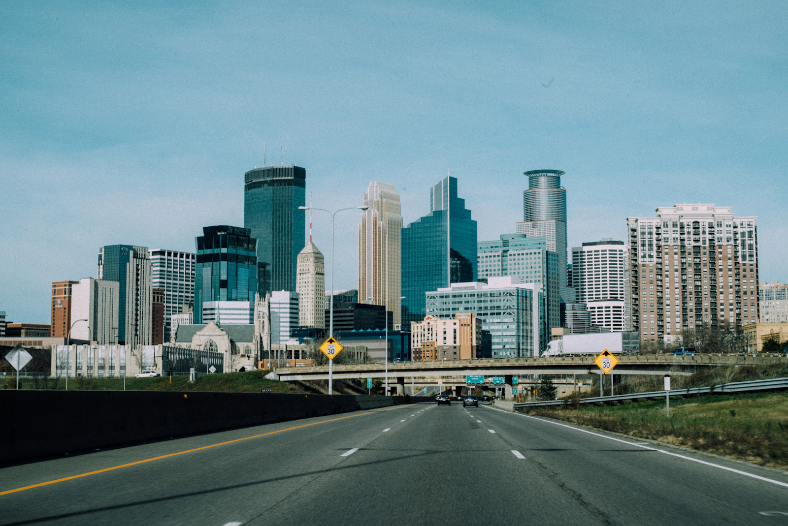 The downtown Minneapolis skyline seen from the highway
