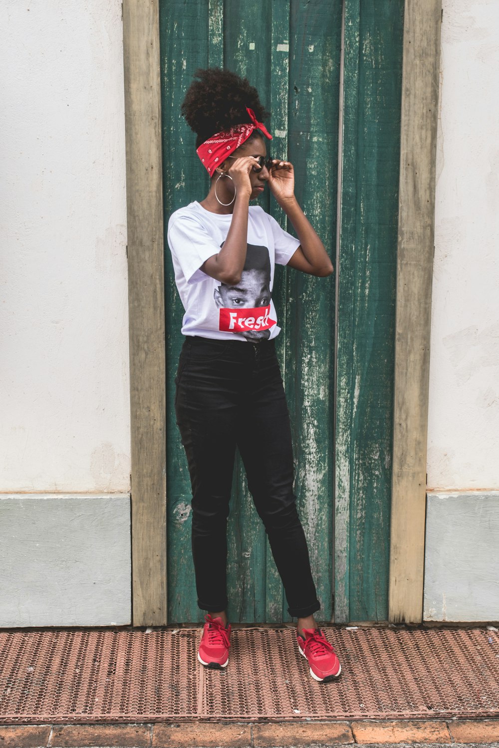 woman standing in front of closed door