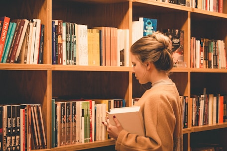 A contemplative professor surrounded by books and notes, reflecting on complex ideas about time and theology.