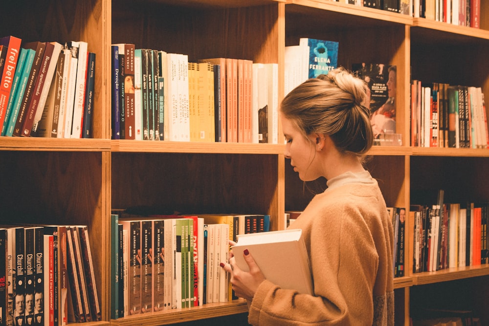 woman holding book