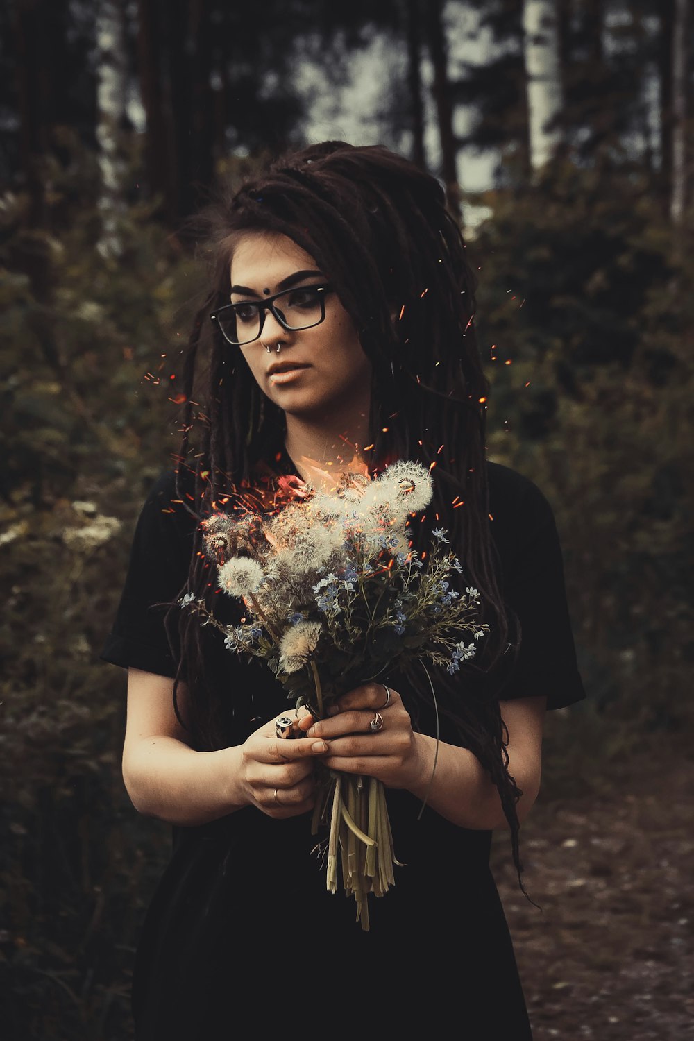 woman holding white flowers