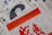 A collection of calendar pages with prominent text indicating '2018 Calendar' in bold red letters. Several pages are layered with a mix of colors, including red, black, white, and blue. There are various numbers and symbols, possibly representing dates and months, with some text in a non-Latin script.