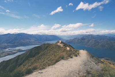 Photography of mountain near body of water