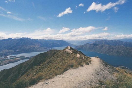 photography of mountain near body of water in Roys Peak Track New Zealand