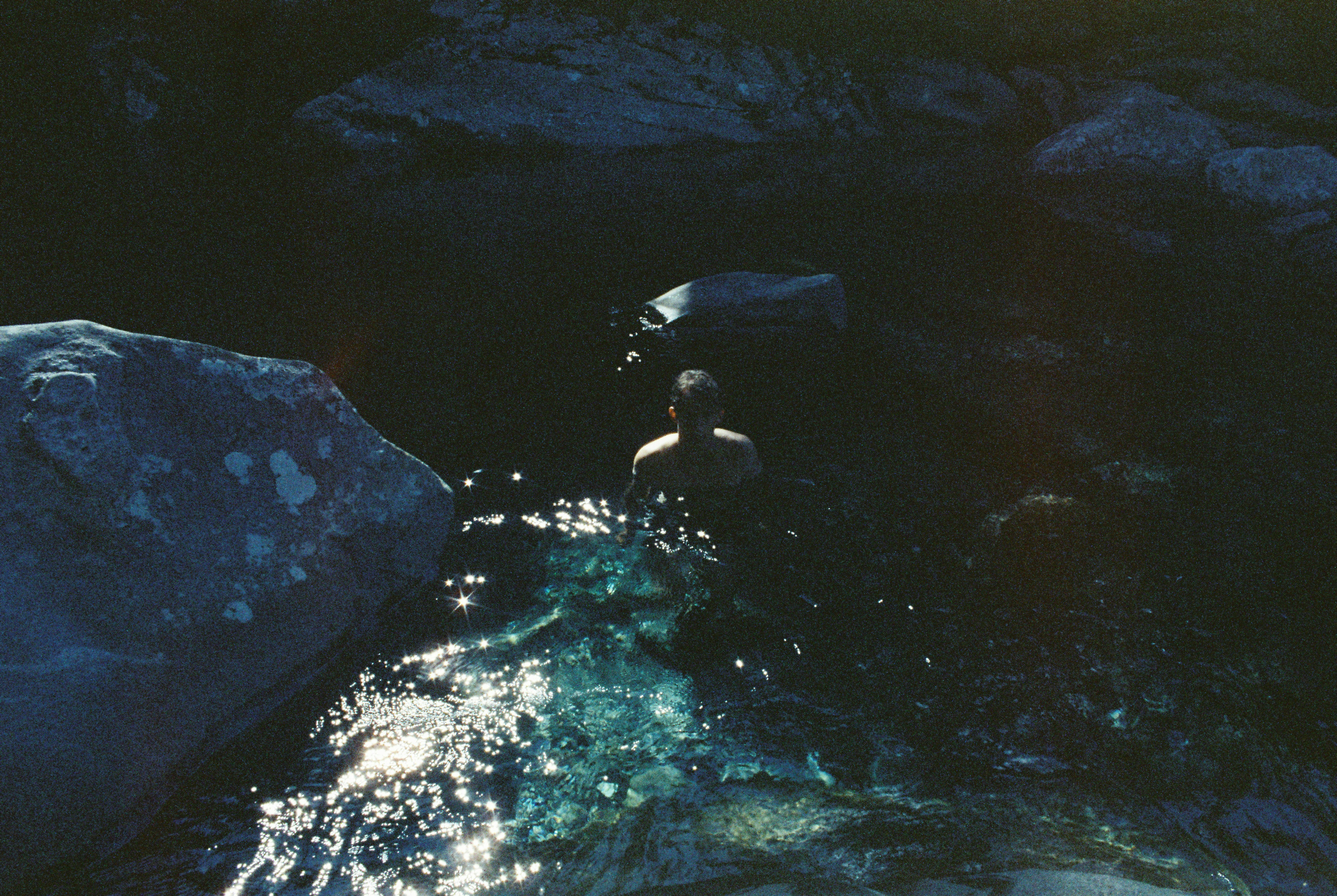 man swimming in river