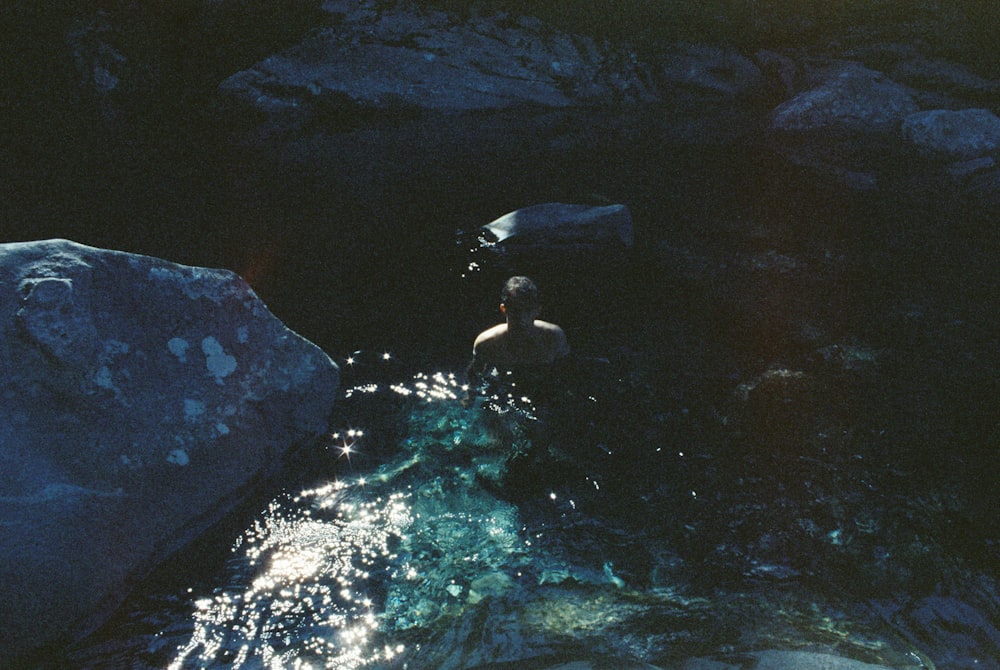 man swimming in river