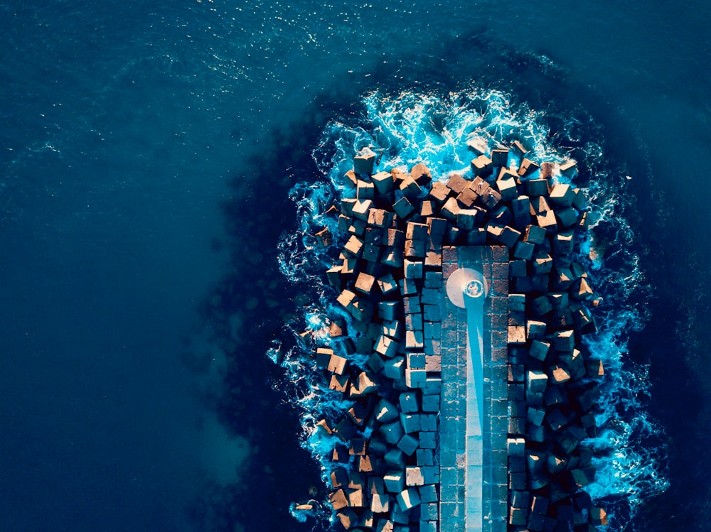 aerial view of rock formation beside sea