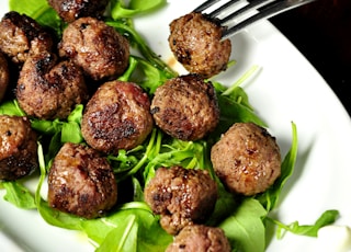 meat balls on oval white plate