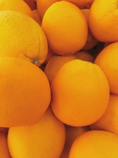 A close-up of fresh fruits stacked in vibrant piles, showcasing quality and freshness