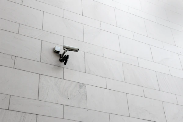Grey surveillance camera on a wall