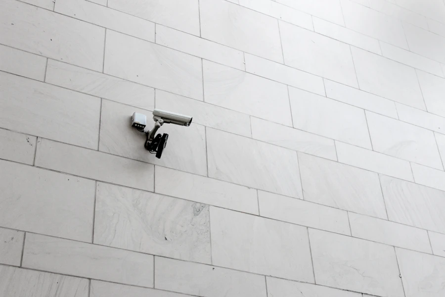 Grey surveillance camera on a wall