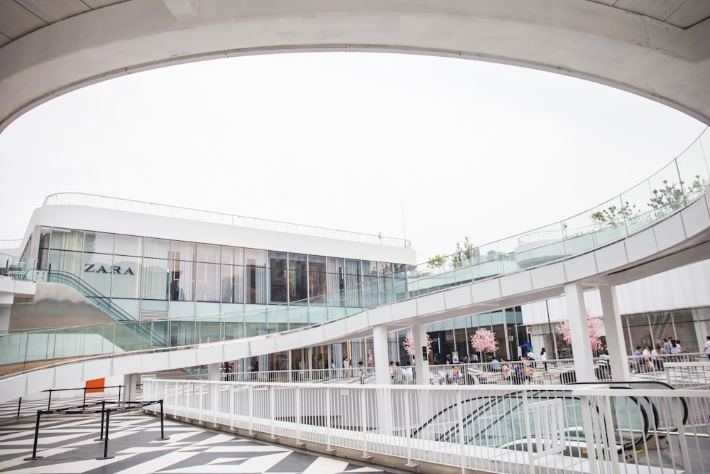 white concrete wall clear glass building