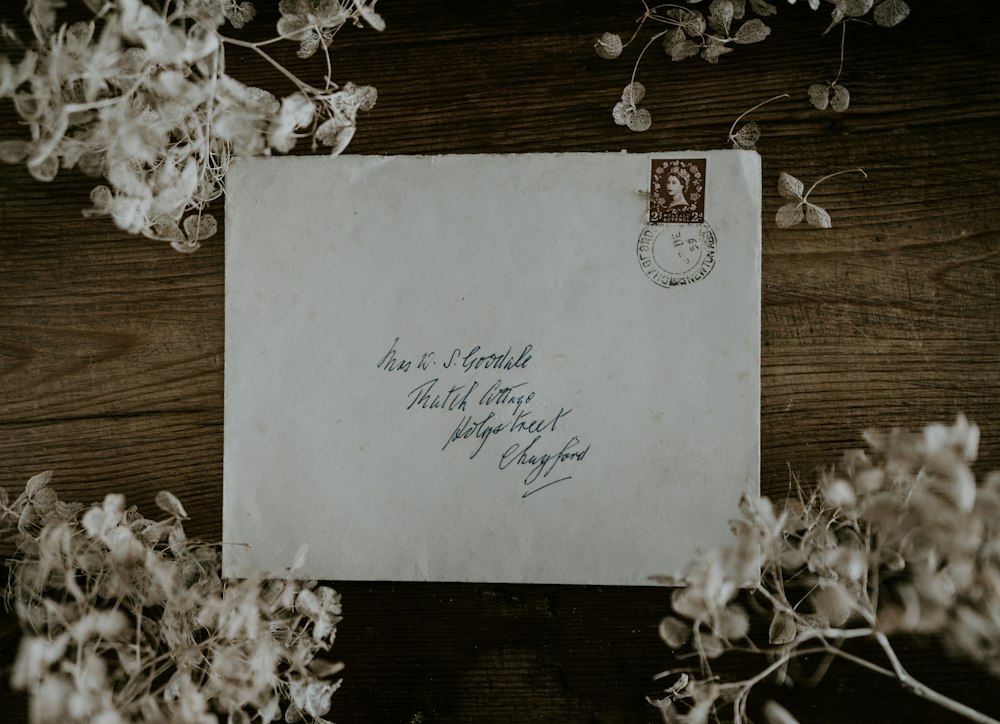 Vintage envelope with a stamp on a wooden table