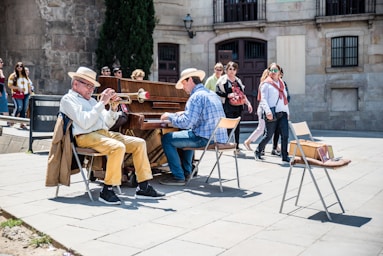 street photography,how to photograph street music in the cathedral square.; two men performing music