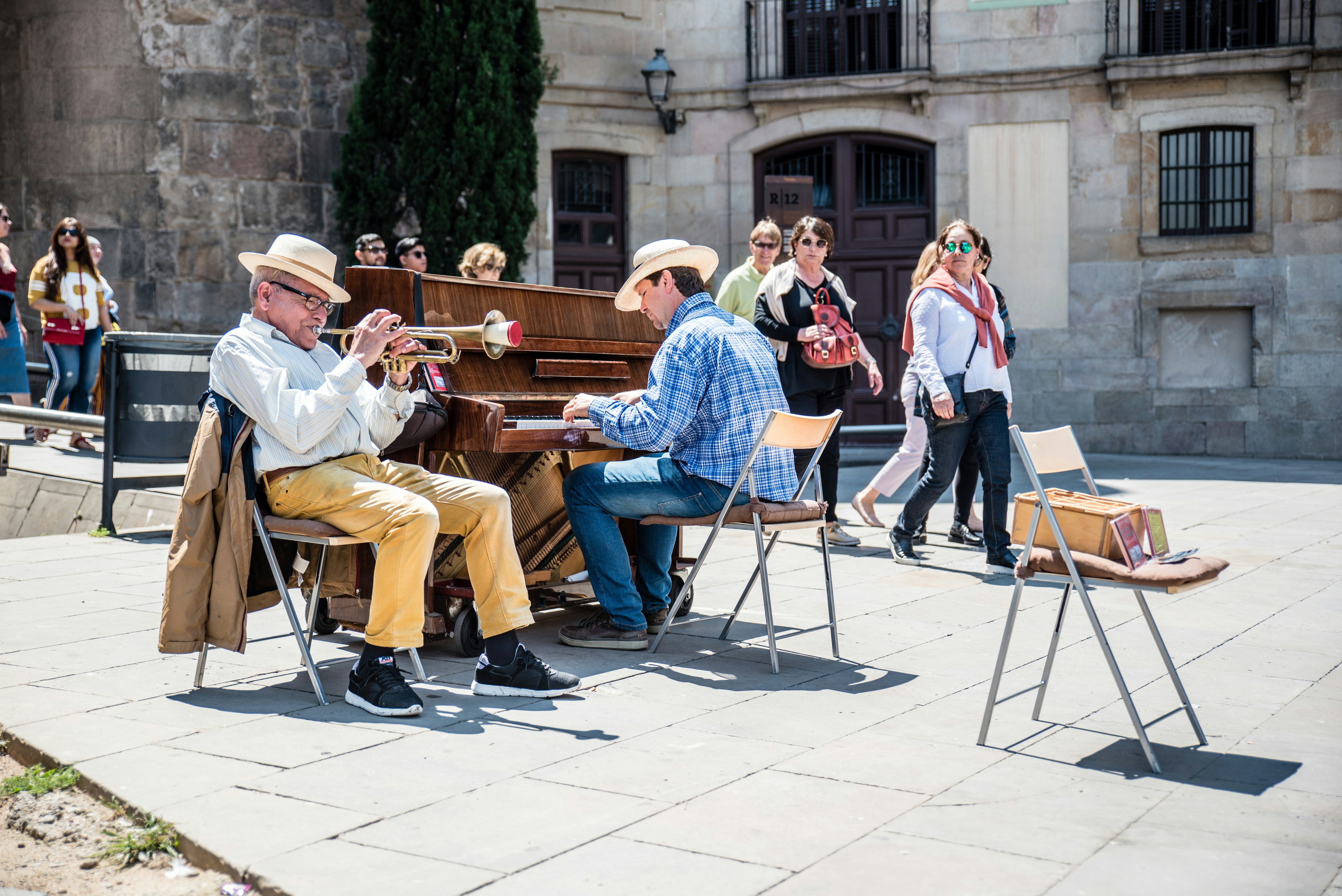 great photo recipe,how to photograph street music in the cathedral square.; two men performing music