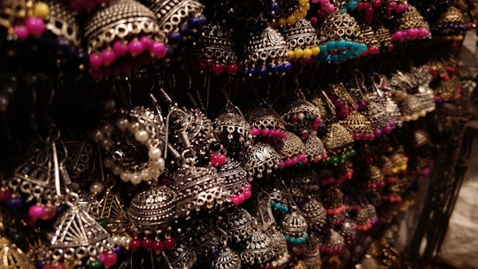 Macro shot of a pair of earrings showcasing the vibrant colors and textures of Murano glass beads