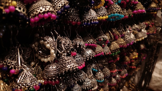 A vibrant display of handcrafted fruit-shaped earrings made with micro crochet.