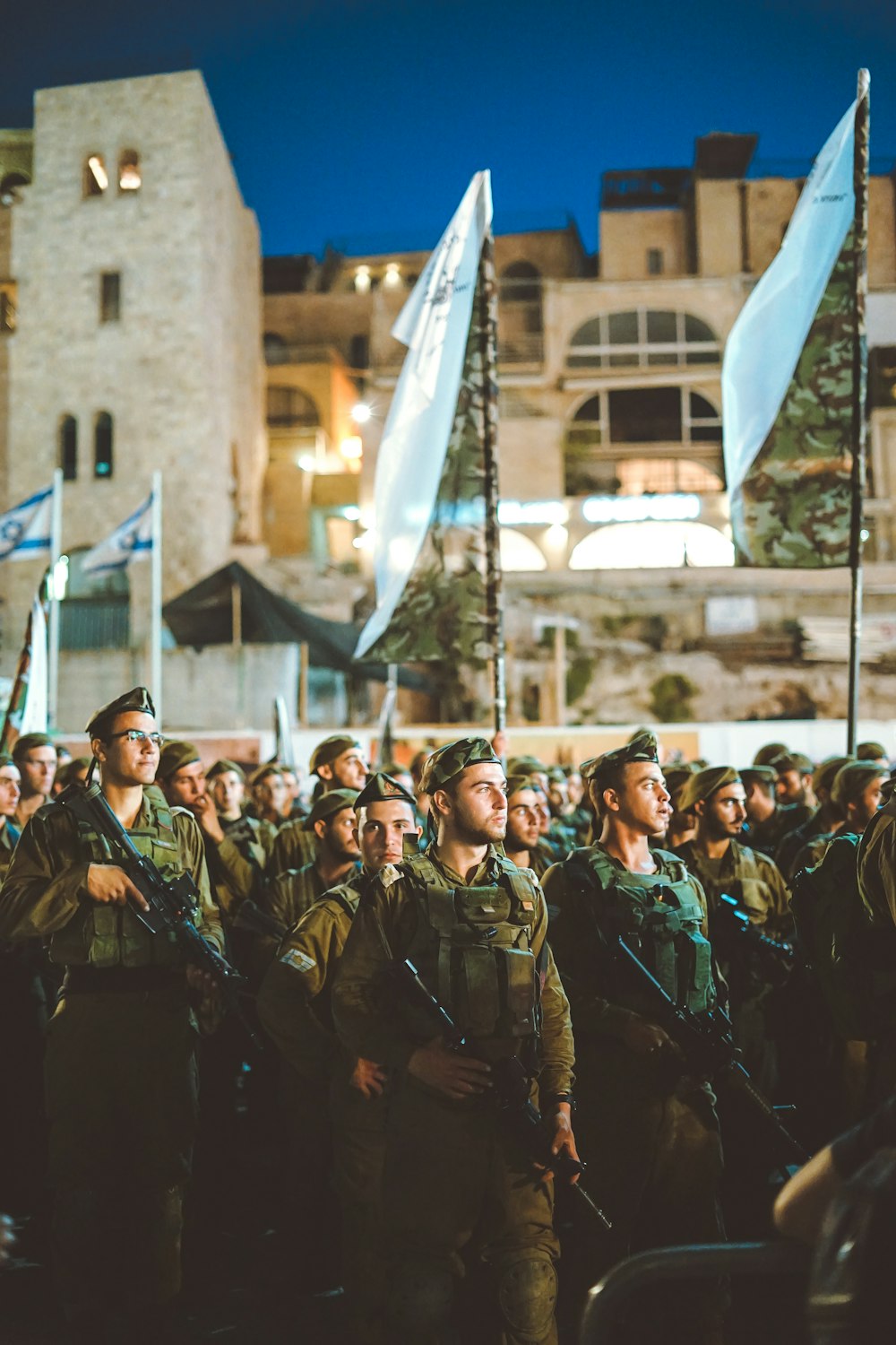 group of armed men with white flag