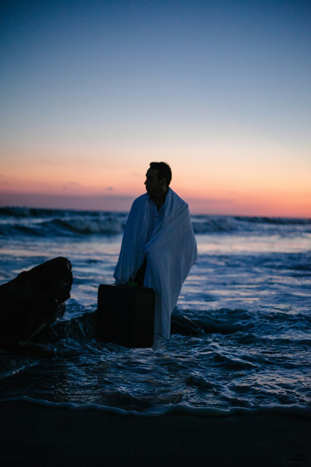 man standing in body of water