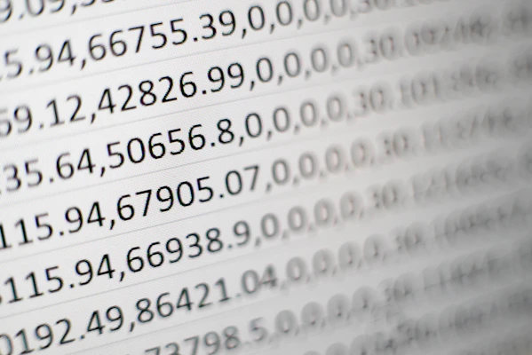 A detailed close-up of a digital database interface with rows of data and blue highlights matching the brand color.