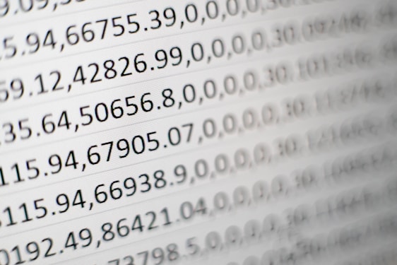 Close-up view of rows of numbers and data entries displayed in a grid format, resembling a spreadsheet or data table.