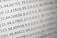 Close-up view of rows of numbers and data entries displayed in a grid format, resembling a spreadsheet or data table.