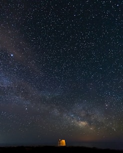 building under stars during nighttime