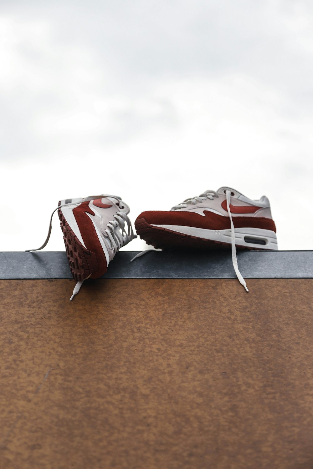 white-and-red Nike sneakers at daytime