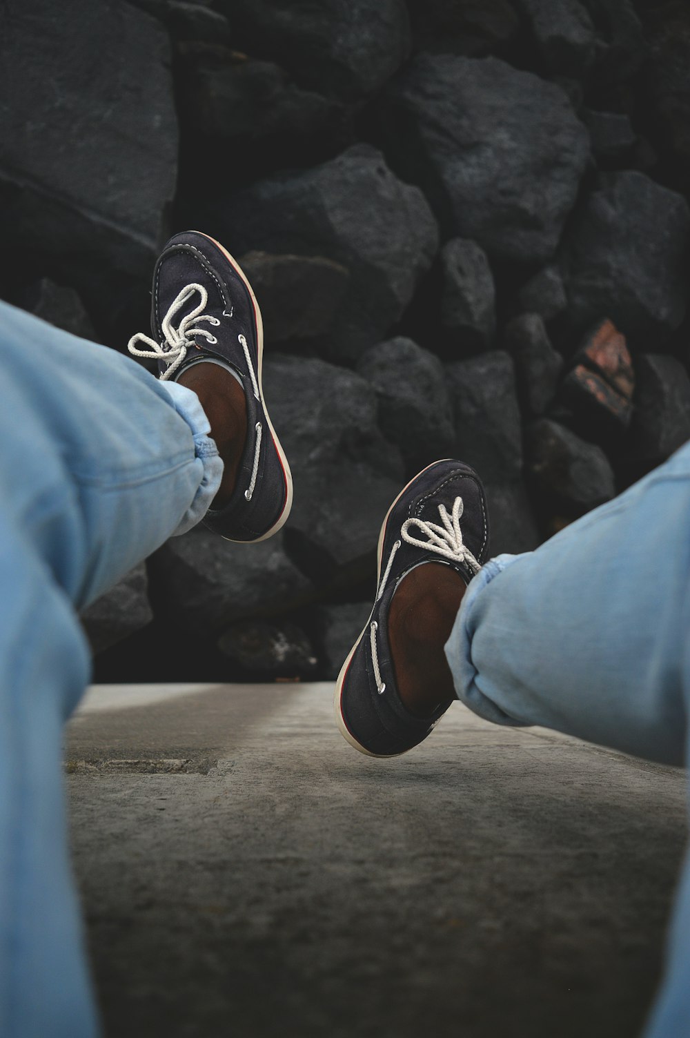 person wearing blue boat shoes